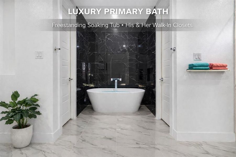 Master Bath - Free Standing Tub with floor to ceiling tile and his/her walk in closets to the right and left