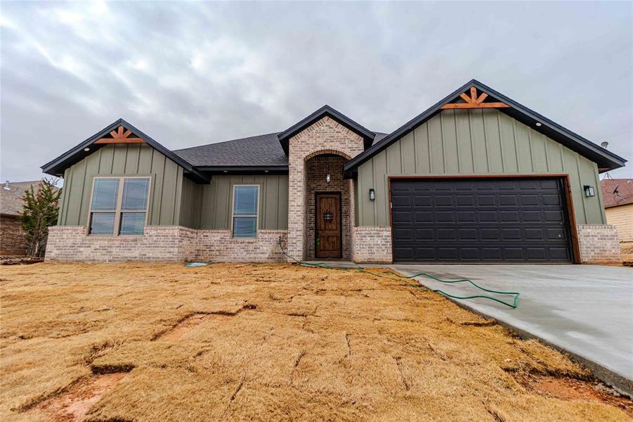 View of front of home featuring a garage