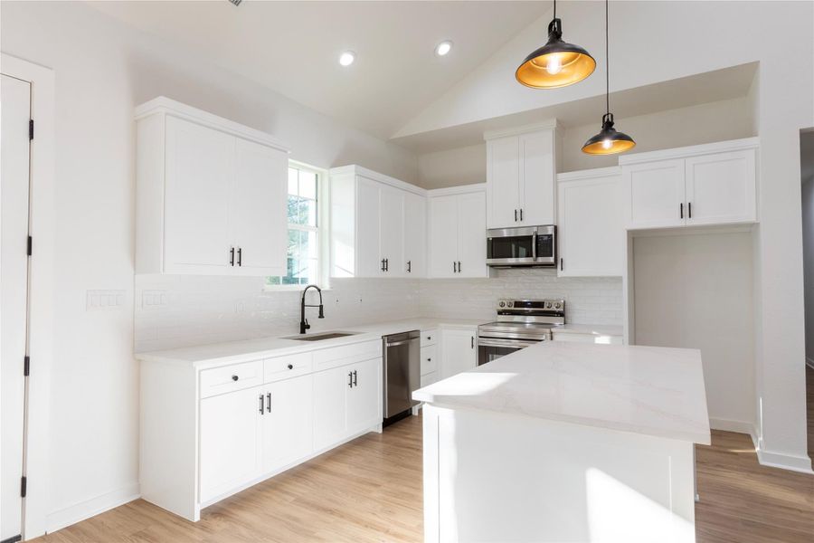 Kitchen featuring custom cabinetry and sleek stainless-steel appliances.