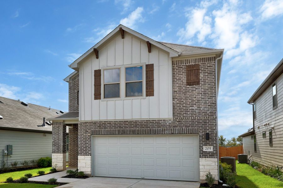 Front exterior of a new home in Trinity Ranch, Elgin, TX, highlighting curb appeal (Image 22).