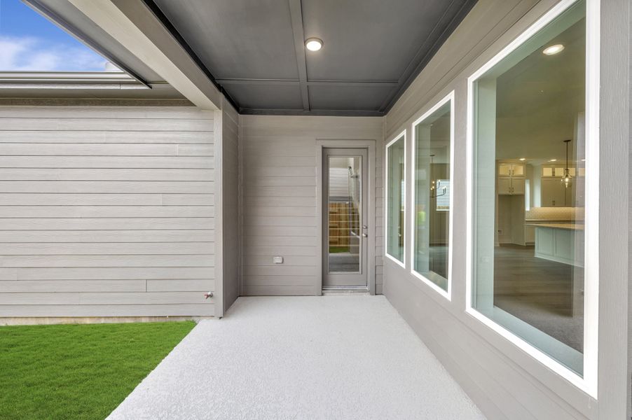 Exterior details and patio area of a home in Elyson - Grove Row Collection, Katy (Image 4).