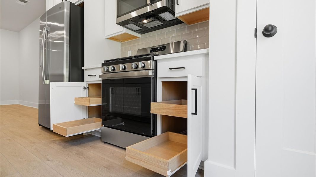 Functional kitchen with stainless steel appliances and ample storage—crafted to high standards by DRB Homes Functional kitchen with stainless steel appliances and ample storage—crafted to high standards by DRB Homes