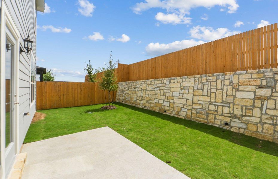 Exterior details and patio area of a home in Cameron Place, Manor (Image 23).