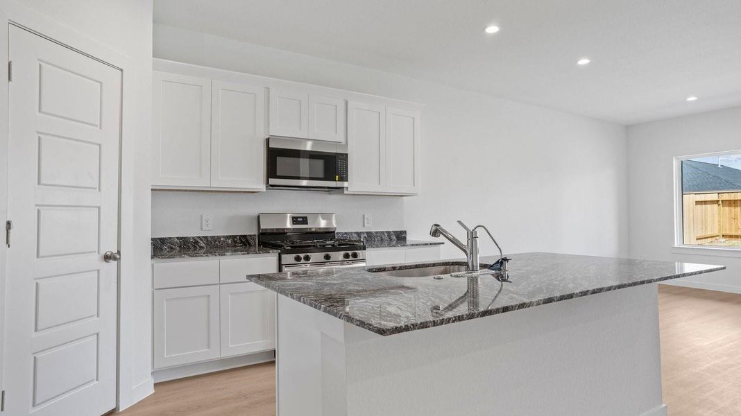 Furnished interior view inside a new home in Caldwell Crossing, Iowa Colony (Image 4).