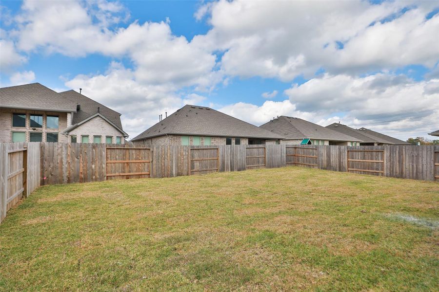 Exterior details and patio area of a home in Coastal Point, League City (Image 3).