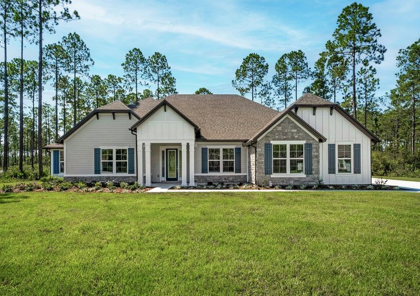 Exterior of the mantle with lush front yard landscaping.