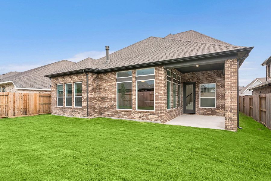 Front exterior of a new home in Riceland 50’ Front Load Homesites, Mont Belvieu, TX, highlighting curb appeal (Image 22). Front exterior of a new home in Riceland 50’ Front Load Homesites, Mont Belvieu, TX, highlighting curb appeal (Image 22).