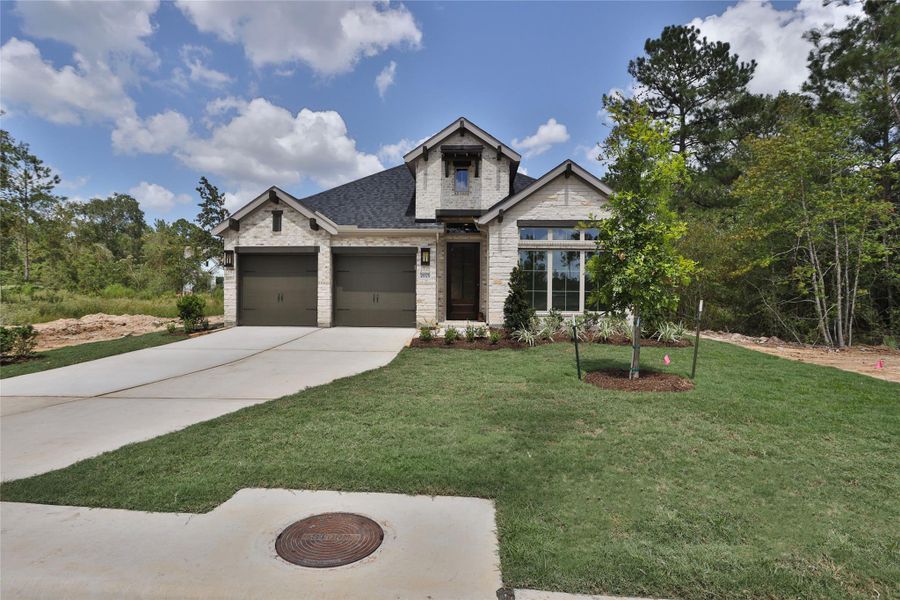 Front exterior of a new home in Kresston, Magnolia, TX, highlighting curb appeal (Image 1). Front exterior of a new home in Kresston, Magnolia, TX, highlighting curb appeal (Image 1).