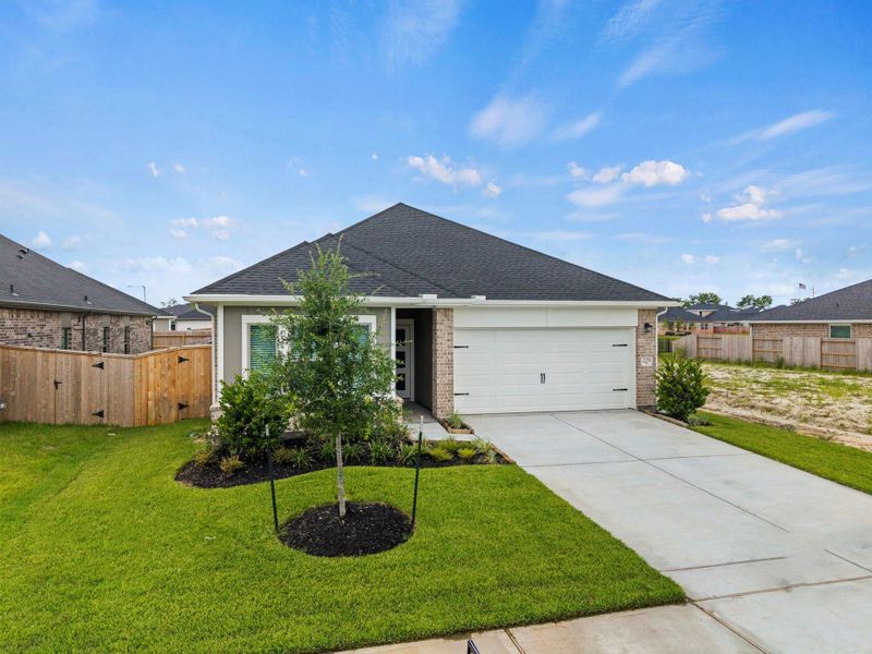 Front exterior of a new home in Laurel Landing, Alvin, TX, highlighting curb appeal (Image 22).