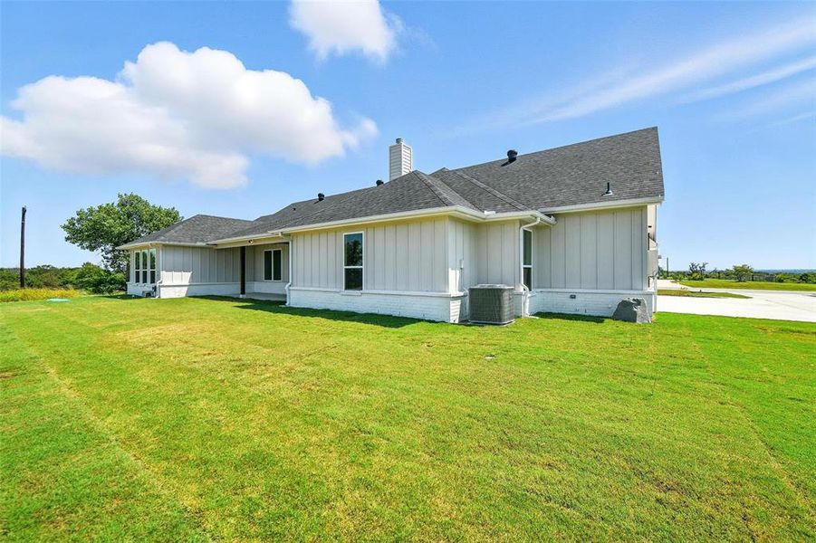 Front exterior of a new home in Rocky Top Ranch, Reno, TX, highlighting curb appeal (Image 20). Front exterior of a new home in Rocky Top Ranch, Reno, TX, highlighting curb appeal (Image 20).