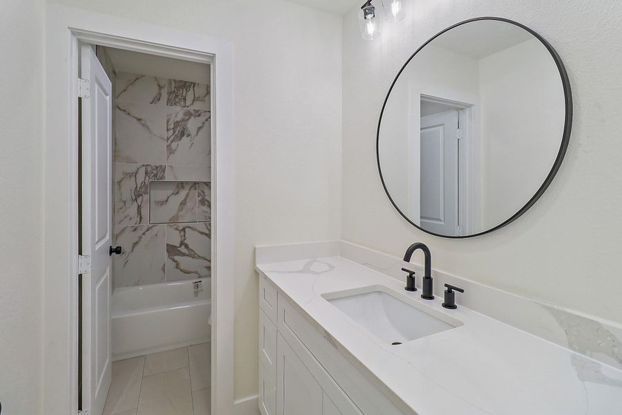 The secondary bathroom upstairs has separate vanity room and door for tub/shower combo and commode.