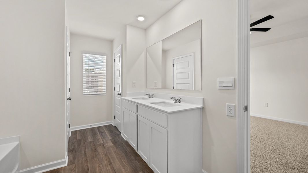 Representative furnished interior of a home built from the Salisbury by D.R. Horton in Inverness at Sugarloaf, Lawrenceville (Image 11).