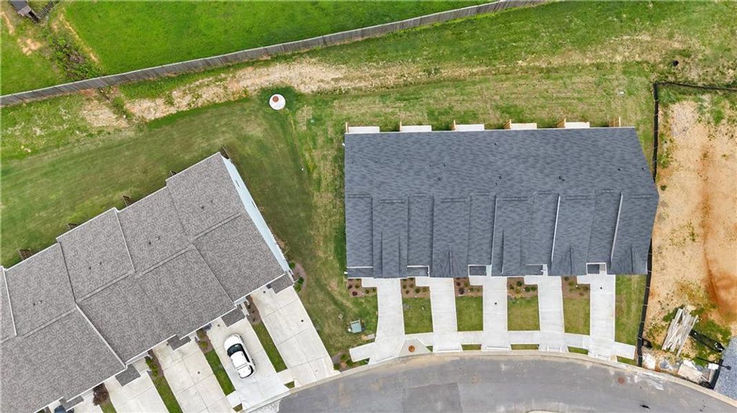 Front exterior of a new home in Village Green, Adairsville, GA, highlighting curb appeal (Image 24).