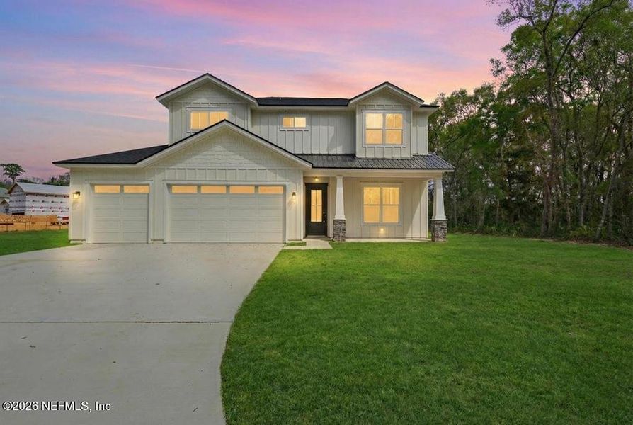 Front exterior of a new home in , Yulee, FL, highlighting curb appeal (Image 1). Front exterior of a new home in , Yulee, FL, highlighting curb appeal (Image 1).