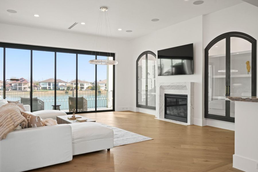 Views of the lake found here!! Marble fireplace mantle is the centerpiece of the living room.