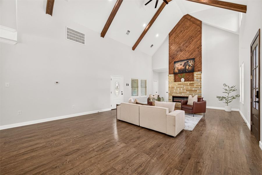 Stunning open living room with soaring ceilings, modern farmhouse finishes, and plenty of space to gather.