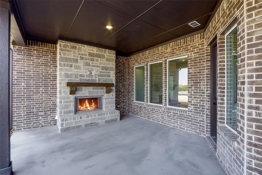 View of patio / terrace with an outdoor stone fireplace