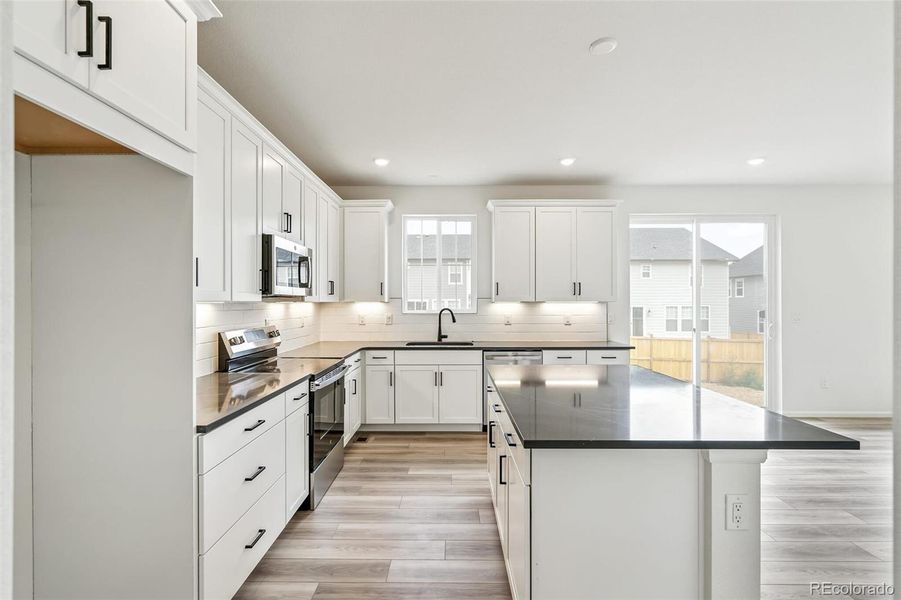 Furnished interior view inside a new home in Windsong, Thornton (Image 10).