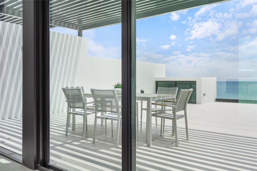 East facing roof-top terrace with ocean views and grill.