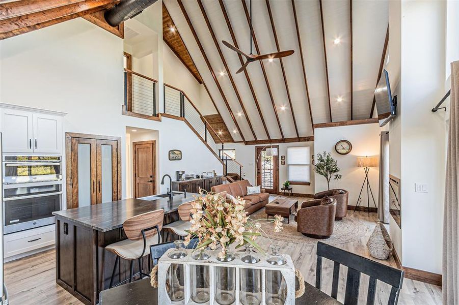 Dining space with light wood finished floors and a ceiling fan