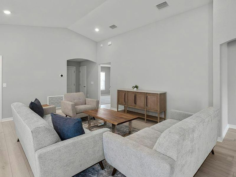 Inside, enjoy a sunny, open living area with LVP flooring.