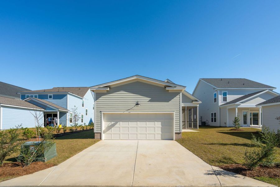 Front exterior of a new home in Nexton, Summerville, SC, highlighting curb appeal (Image 2). Front exterior of a new home in Nexton, Summerville, SC, highlighting curb appeal (Image 2).