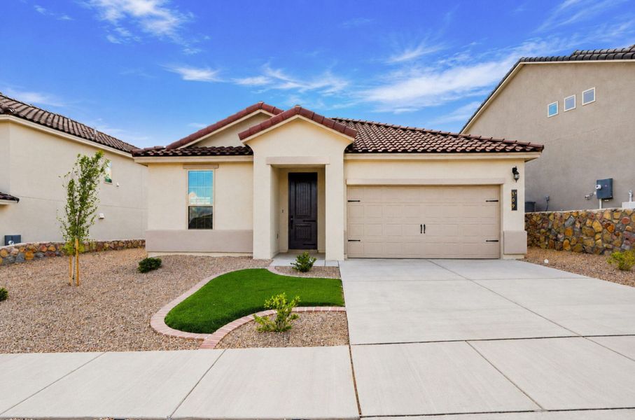 Front exterior of a new home in Emerald Estates, Horizon City, TX, highlighting curb appeal (Image 25). Front exterior of a new home in Emerald Estates, Horizon City, TX, highlighting curb appeal (Image 25).