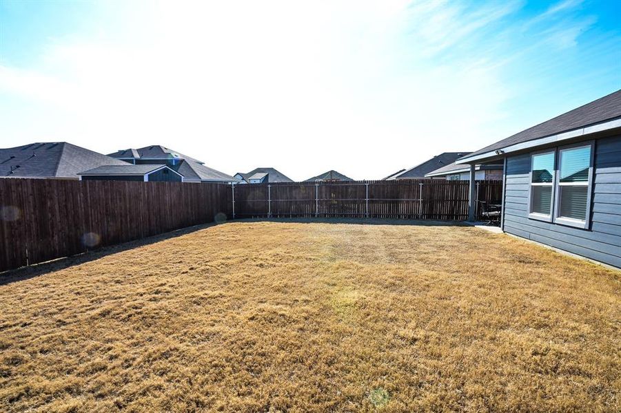 View of yard with a fenced backyard