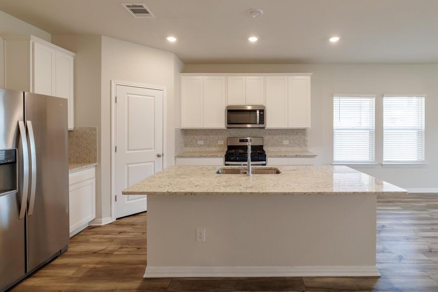 Furnished interior view inside a new home in , Manor (Image 4).