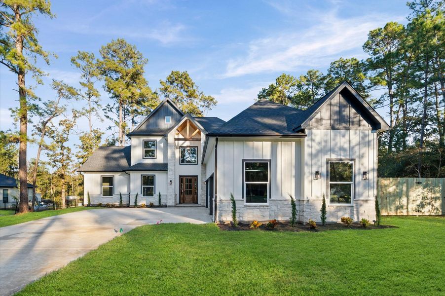 Front exterior of a new home in , Magnolia, TX, highlighting curb appeal (Image 2).