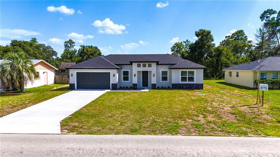 Front exterior of a new home in , Ocala, FL, highlighting curb appeal (Image 23).