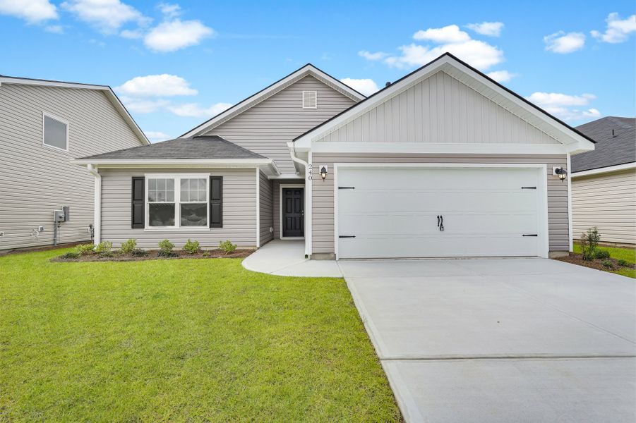 Front exterior of a new home in Heritage at New Riverside, Bluffton, SC, highlighting curb appeal (Image 2). Front exterior of a new home in Heritage at New Riverside, Bluffton, SC, highlighting curb appeal (Image 2).