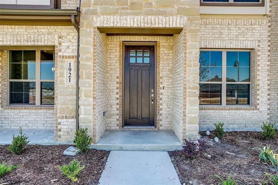 Property entrance with brick siding