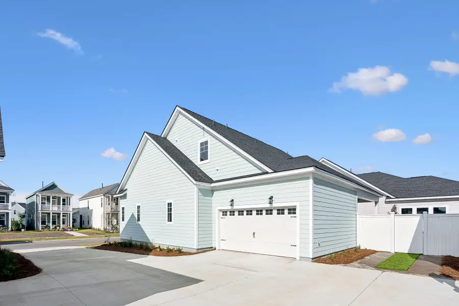 Front exterior of a new home in Nexton – Midtown – The Garden Collection, Summerville, SC, highlighting curb appeal (Image 2). Front exterior of a new home in Nexton – Midtown – The Garden Collection, Summerville, SC, highlighting curb appeal (Image 2).