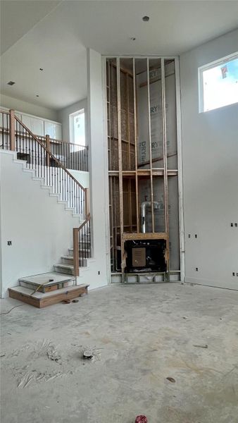Family Room with soaring ceiling & Fireplace