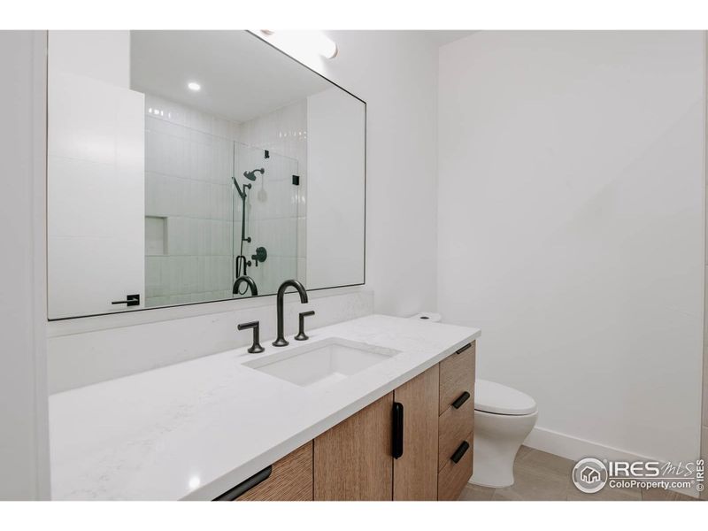 Main floor bathroom with walnut floating vanity