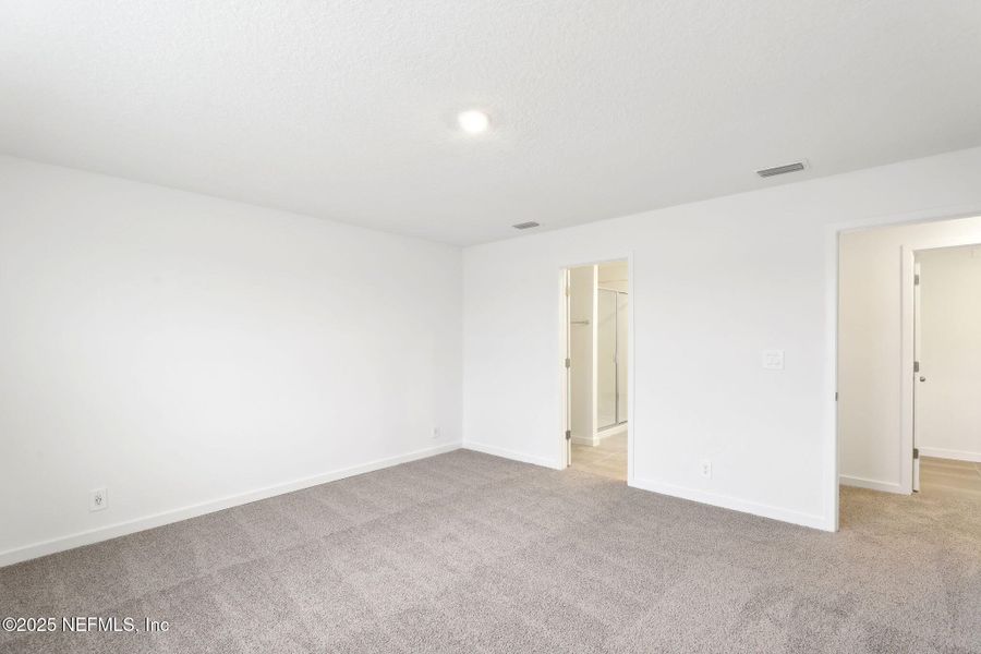 Spacious, unfurnished interior of a new home in Lakes at Bella Lago - Signature Series, Green Cove Springs (Image 27). Spacious, unfurnished interior of a new home in Lakes at Bella Lago - Signature Series, Green Cove Springs (Image 27).