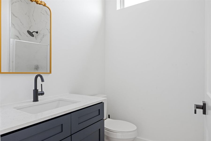 Full bathroom with vanity and a shower stall Full bathroom with vanity and a shower stall