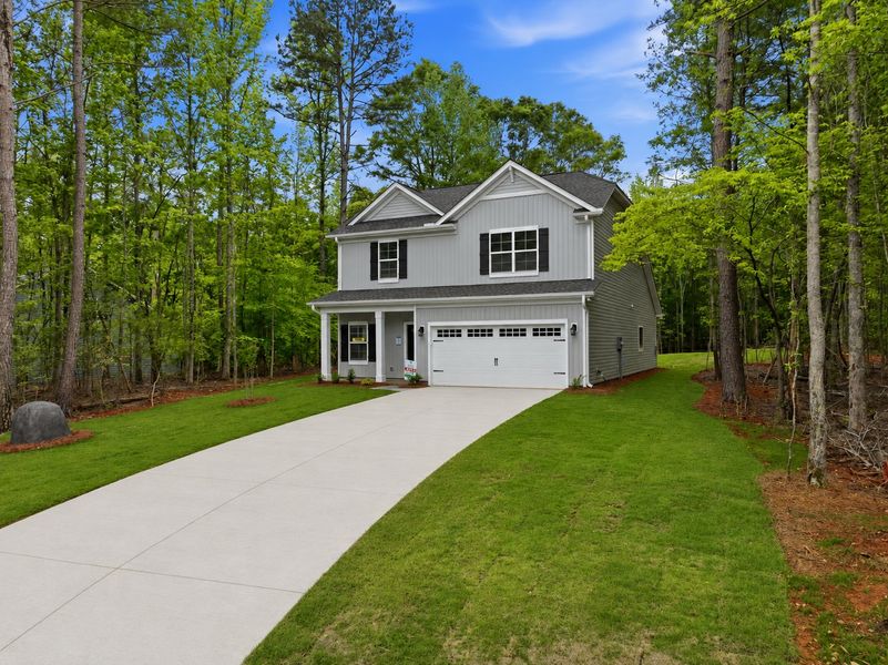 Front exterior of a new home in Broadway Lake, Anderson, SC, highlighting curb appeal (Image 20). Front exterior of a new home in Broadway Lake, Anderson, SC, highlighting curb appeal (Image 20).