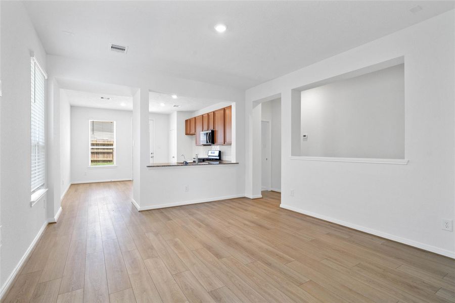 Stunning open-concept design seamlessly connecting the living, dining, and kitchen areas—perfect for both everyday living and entertaining! Stunning open-concept design seamlessly connecting the living, dining, and kitchen areas—perfect for both everyday living and entertaining!