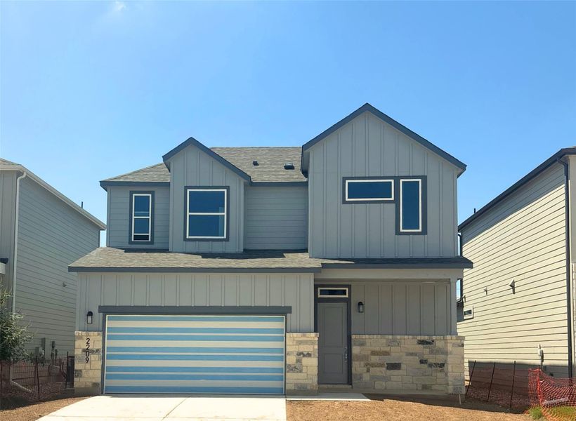 View of front of home featuring a shingled roof, board and batten siding, stone siding, driveway, and an attached garage View of front of home featuring a shingled roof, board and batten siding, stone siding, driveway, and an attached garage