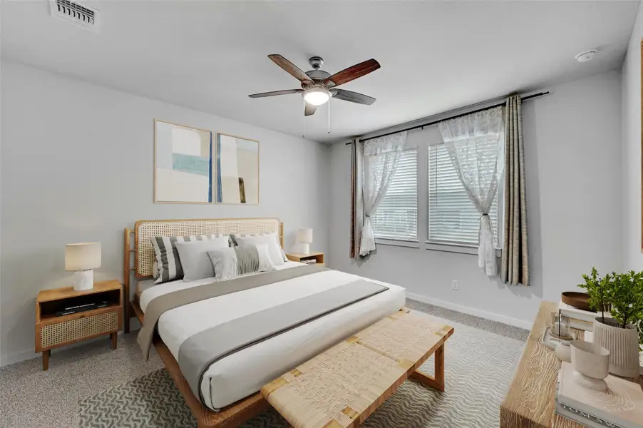 Bedroom with carpet floors and ceiling fan Bedroom with carpet floors and ceiling fan