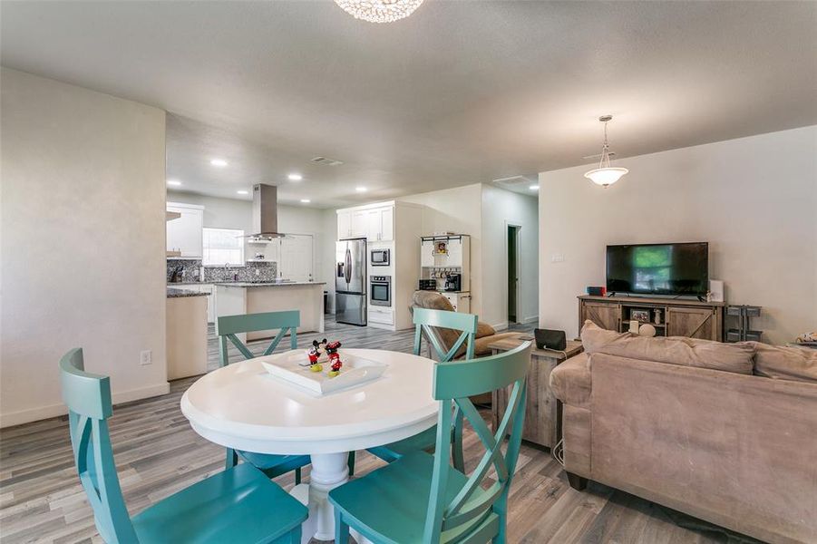 Dining space featuring light wood-style floors and recessed lighting Dining space featuring light wood-style floors and recessed lighting
