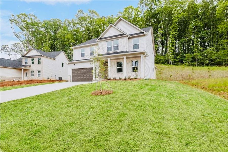 Front exterior of a new home in , Villa Rica, GA, highlighting curb appeal (Image 18).