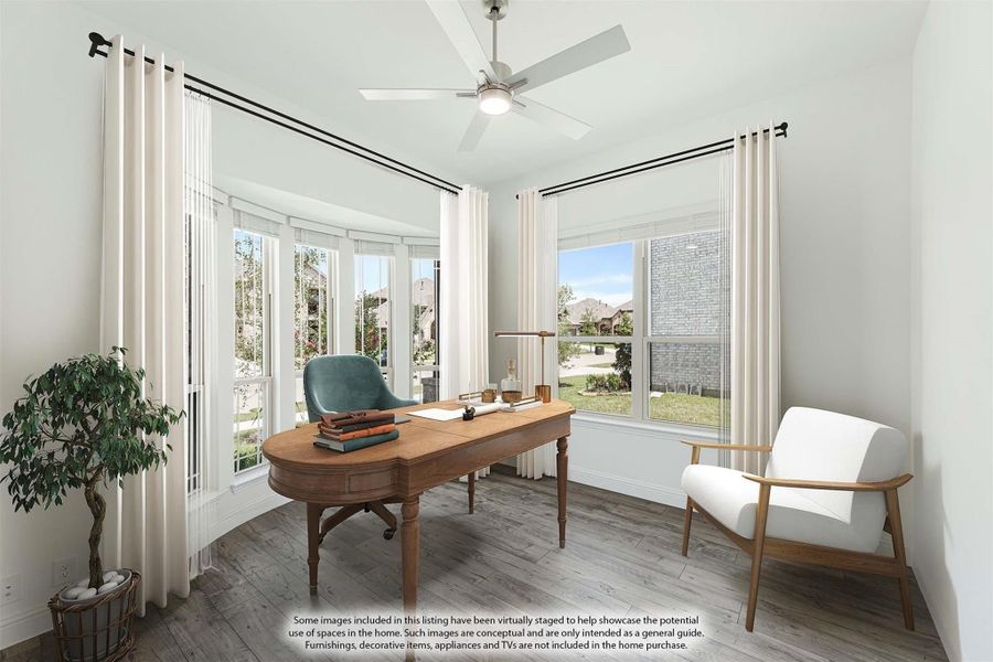 Home office with wood desk, ceiling fan, large windows, and hardwood floors Home office with wood desk, ceiling fan, large windows, and hardwood floors
