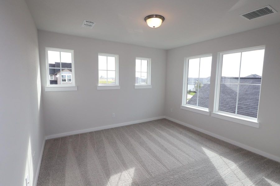 Spacious, unfurnished interior of a new home in The Cove at Mason Woods, Cypress (Image 15).