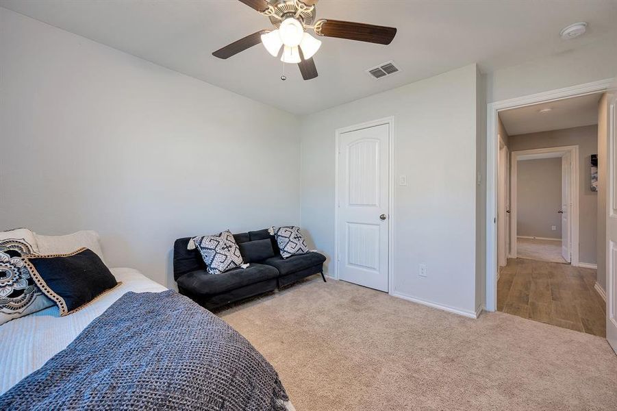 Bedroom featuring carpet and a ceiling fan