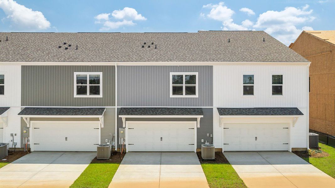 Front exterior of a new home in The Crossing at St. James, Summerville, SC, highlighting curb appeal (Image 2).