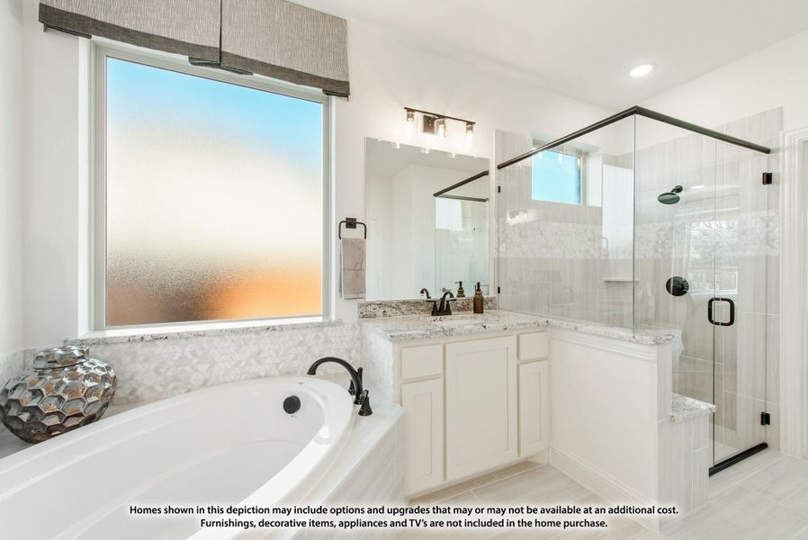 Master bathroom with soaking tub, glass walk-in shower, white vanity, and granite countertops