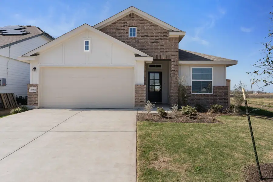 Front exterior of a new home in Briarwood, Elgin, TX, highlighting curb appeal (Image 15).